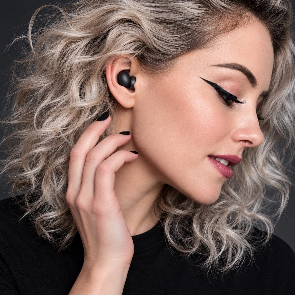 Person wearing JetNod Quiet earplugs