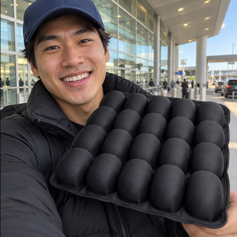Man in a cap holding the seat cushion outside an airport