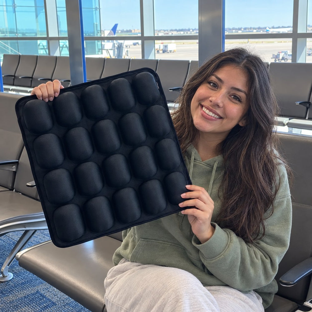 Woman holding the seat cushion at an airport gate