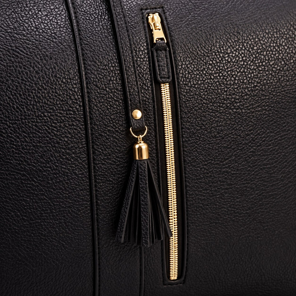 Front zip pocket with tassel on the Black bag
