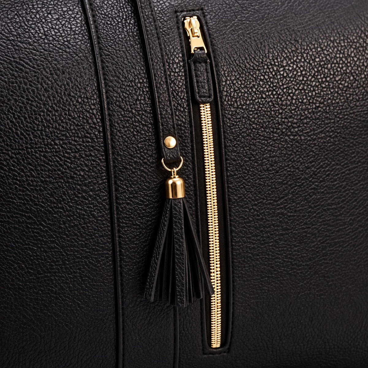 Front zip pocket with tassel on the Black bag